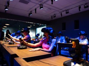 A group of invited guests testing out Dreamscape classroom virtual reality headset equipment