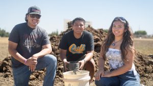 Latin X Students in a dirt field for a soil science class